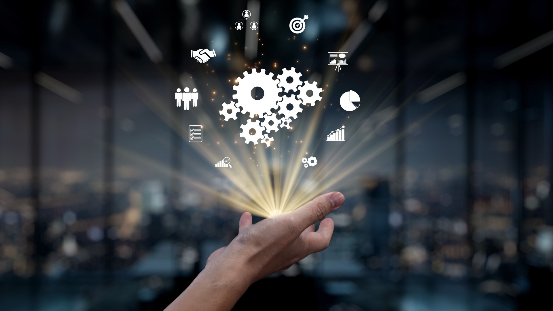 Hand Releasing Gears and Icons Representing Innovation, Technology, Business Solutions, and Teamwork in a Corporate Environment. Auvana